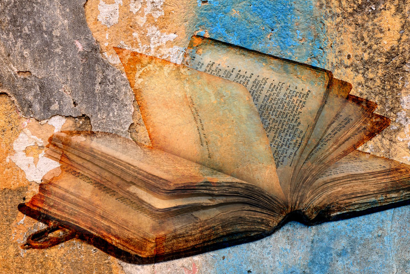ancient torah over cracked paint concrete wall