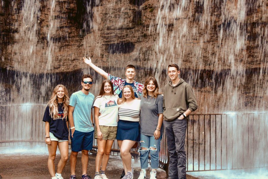 CC Plus Odyssey students at a waterfall